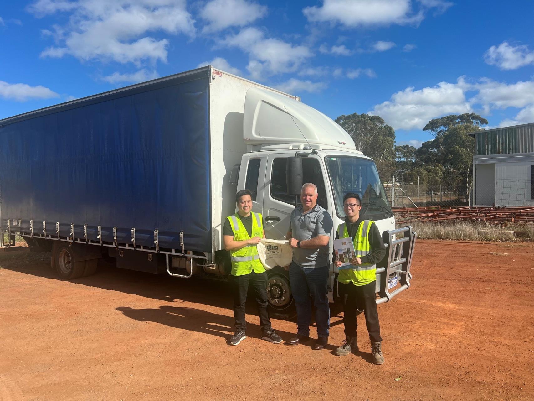 Shire President Leigh Ballard posing with a new buisiness with their 'Welcome Pack'